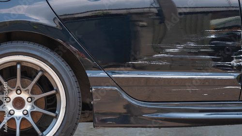 Wallpaper Mural Damaged scratch on black car surface after accident Torontodigital.ca