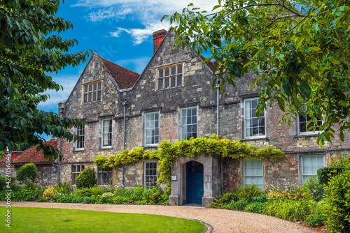 Bild auf Leinwand medieval stone building of the Diocesan offices, Winchester, Cathedral Close, Ha