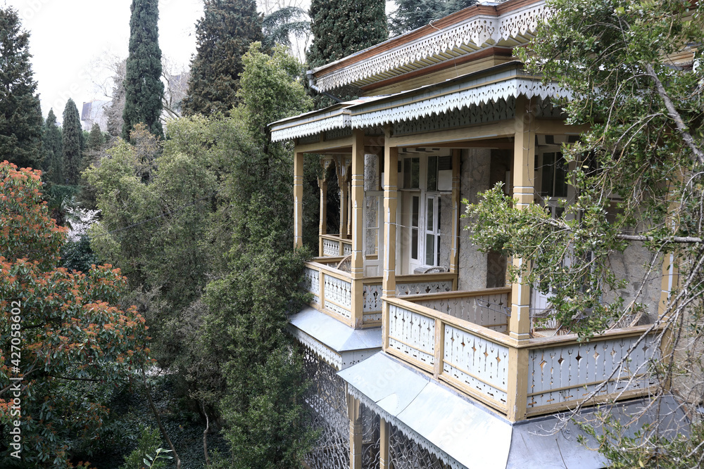 Building with wooden balcony in Gurzuf park Building with wooden balcony in Gurzuf park