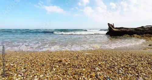 Timelapse of waves lapping the beach at El Perelló, Catalonia. Mediterranean Sea. photo