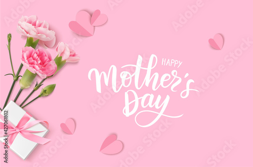 Happy Mothers day. Calligraphic greeting text. Holiday design template with realistic pink carnation flowers, gift box and paper hearts on pink background. Vector stock illustration.