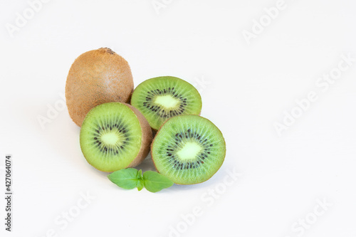 Whole and halves kiwi fruits isolated on white background with text space
