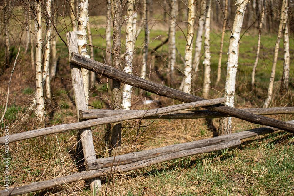 old ruined wooden fence on the farm