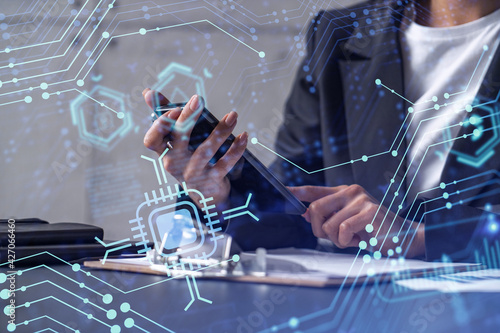 Businesswoman in formal wear checking the phone to sign the contract to create a software to present it at start up conference and gain investments for innovative service. Hologram tech graphs.