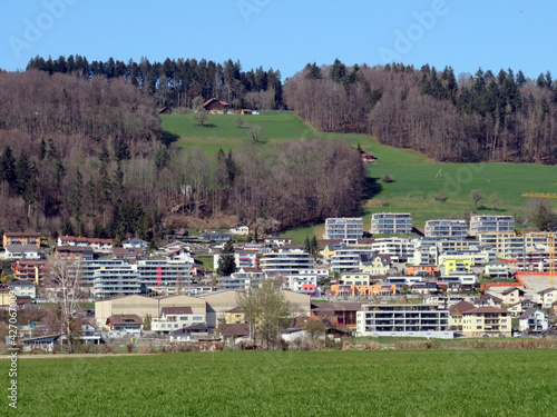 A small modern Swiss settlement or village Wauwil on the slopes of the hill Egozwilerberg - Canton of Lucerne, Switzerland (Schweiz) photo