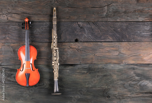 violin and clarinet isolated on wooden background © serikbaib