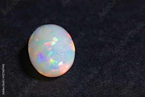 Opal gem close-up on a black background photo