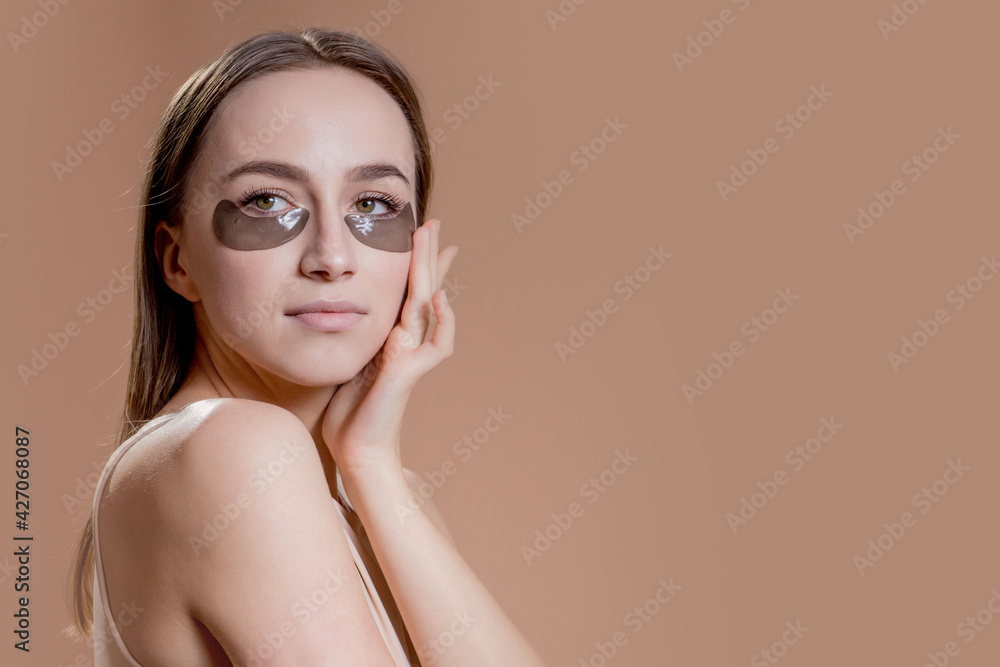 Eye patch, Beautiful Woman With Natural Makeup And Black Hydro Gel Eye Patches On Facial Skin Eye patch, Beautiful Woman With Natural Makeup And Black Hydro Gel Eye Patches On Facial Skin