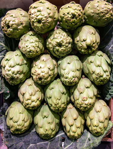 Fresh artichoke group on market. Healthy and vegetarian food concept. 