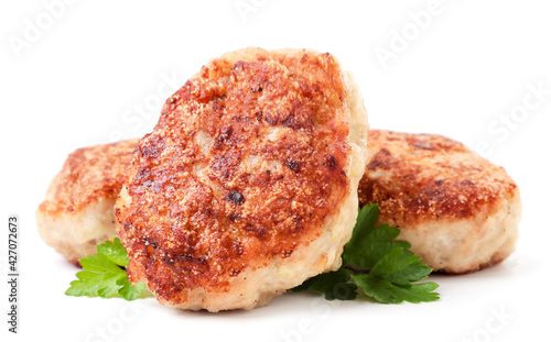 Fried cutlets with parsley on a white background. Isolated