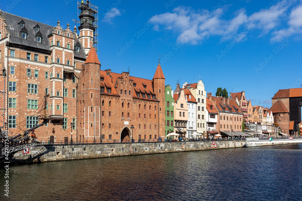  Old town of Gdansk with the Mariacka Gate and a promenade along the riverbank of Motlawa River