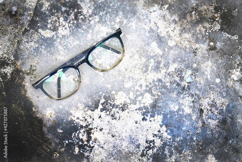 Fotografie Clear eyeglasses, Glasses transparent dark blue frame Vintage style on grungy co