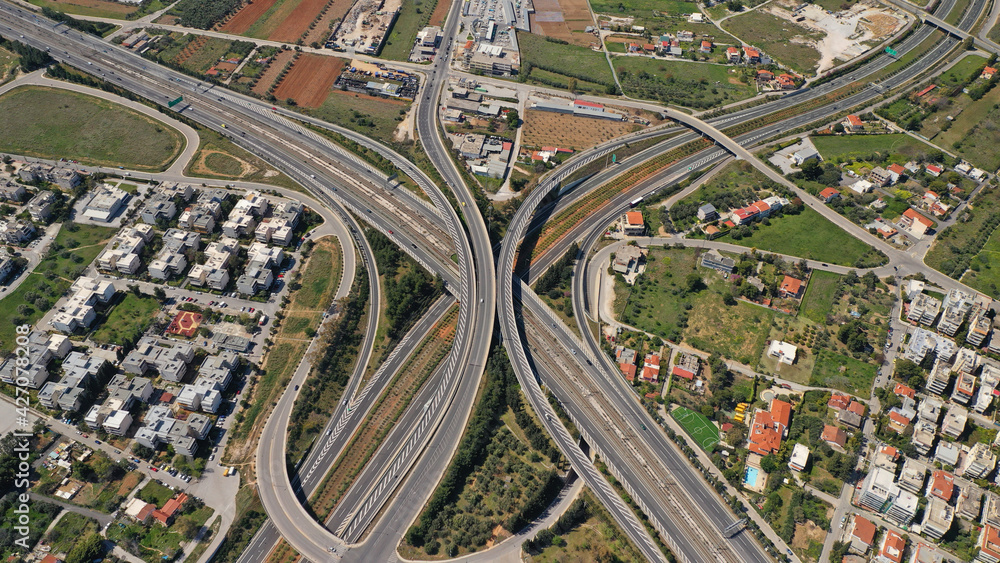 Aerial drone photo of multilevel highway junction toll road of Attiki Odos connecting Attica to Athens International Airport of Eleftherios Venizelos, Attica, Greece Aerial drone photo of multilevel highway junction toll road of Attiki Odos connecting Attica to Athens International Airport of Eleftherios Venizelos, Attica, Greece