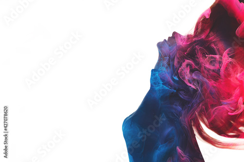 Double exposure silhouette. Spiritual aura. Esoteric enlightenment. Blue pink ethereal mist chakra in dark contrast profile outline of inspired woman body isolated on white copy space background.