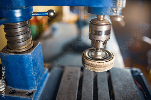 Drilling machine at the workplace of a toolman locksmith photo