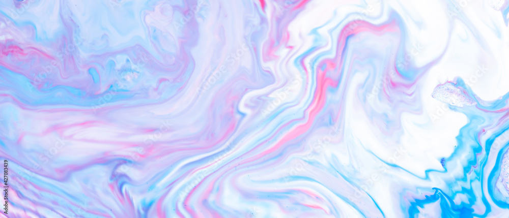 Fluid art. Abstract lilac pink background. Liquid marble texture design. Blue-pink pattern with liquid material