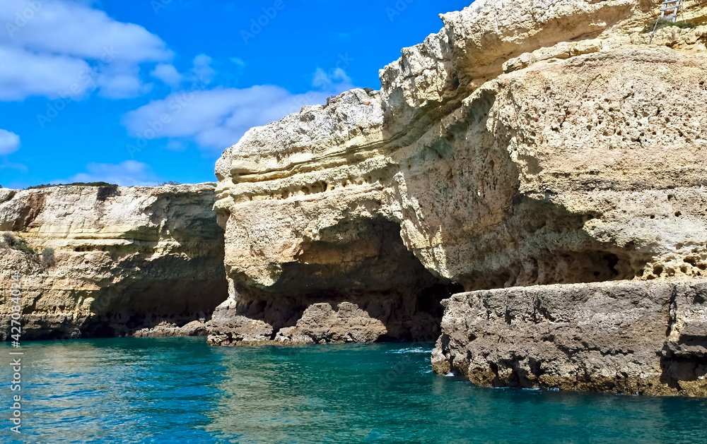 Fototapeta premium Beautiful caves in turquoise water between Albufeira and Benagil cave
