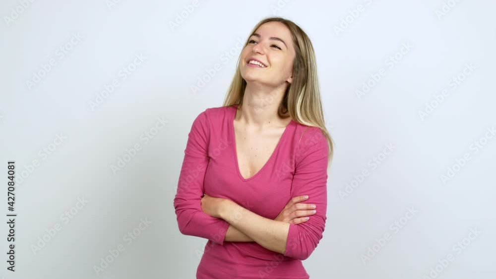 Young woman keeping the arms crossed while smiling over isolated background Young woman keeping the arms crossed while smiling over isolated background