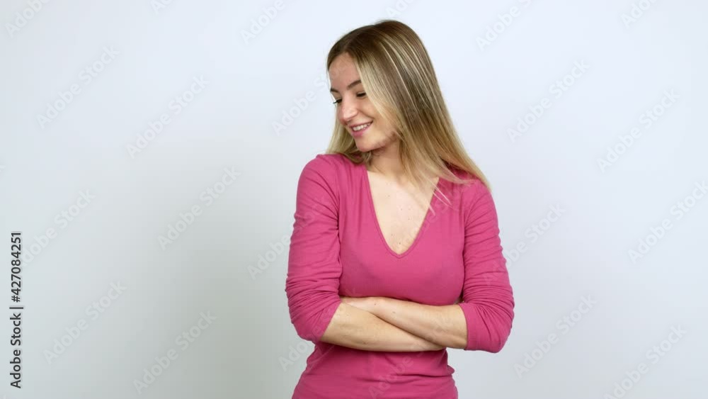 Young woman smiling and looking to the front with confident face over isolated background Young woman smiling and looking to the front with confident face over isolated background