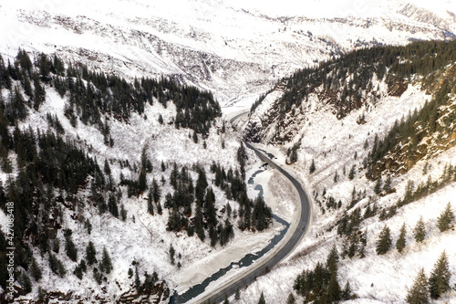 Aerial view of the Richardson Highway, Keystone Canyon, and Lowe River near Valdez, Alaska during the winter.