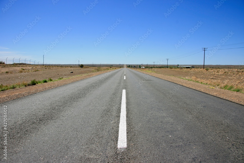 Hitchhiking along empty highway with no people in Keetmanshoop, Namibia. Hitchhiking along empty highway with no people in Keetmanshoop, Namibia.