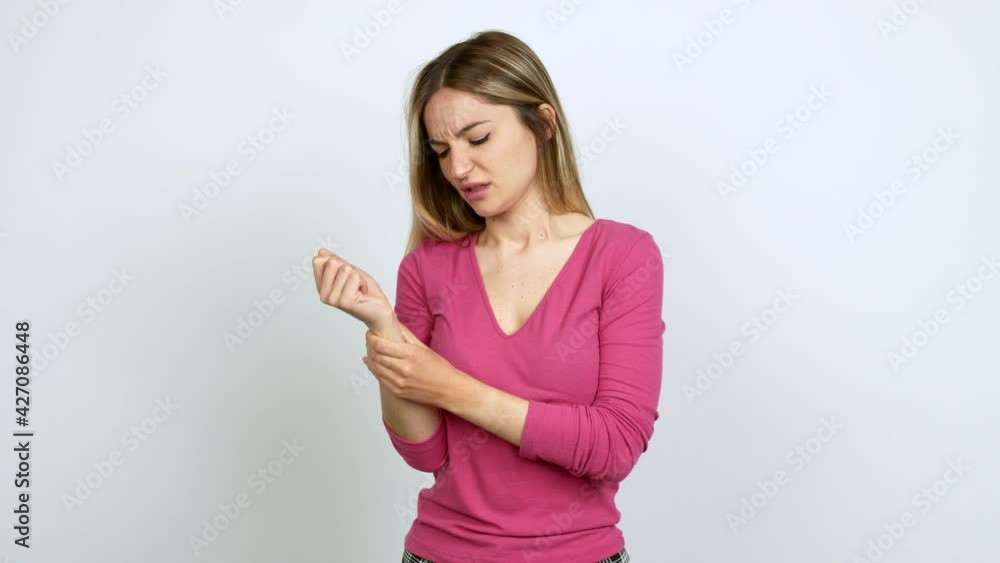 Young woman with pain in hand over isolated background Young woman with pain in hand over isolated background