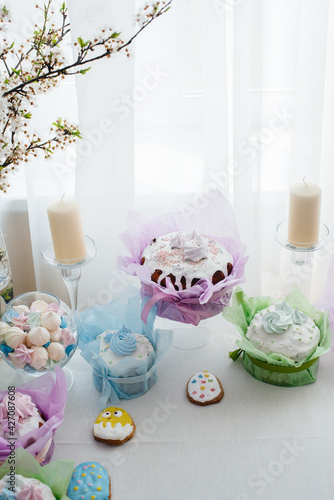 Beautiful Easter cakes on a decorated light table. A light holiday of Easter. © Andrii