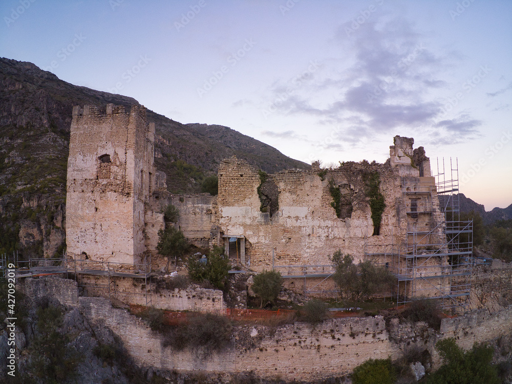 drone view of a ruined castle on the Serpis greenway in Alcoy, located in Valencia, Spain.