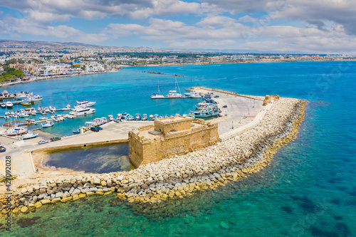 Fototapeta Naklejka Na Ścianę i Meble -  Ancient castle in cyprus. Antique fort off coast of paphos. Medieval port castle in harbor. Attractions of the city of Paphos. Bird eye view of harbor in Cyprus. Paphos museums. Travel Cyprus
