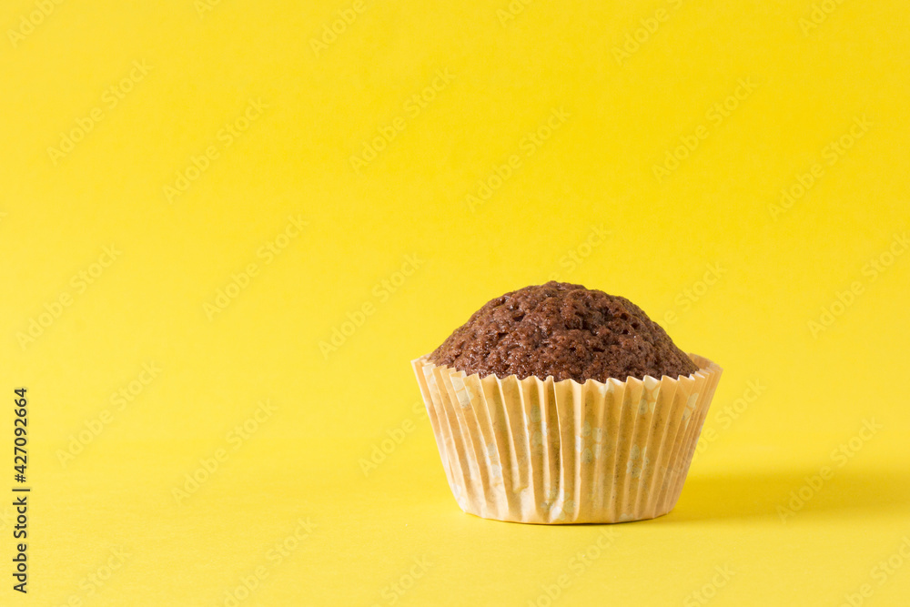 homemade muffin, cake on a yellow background homemade muffin, cake on a yellow background