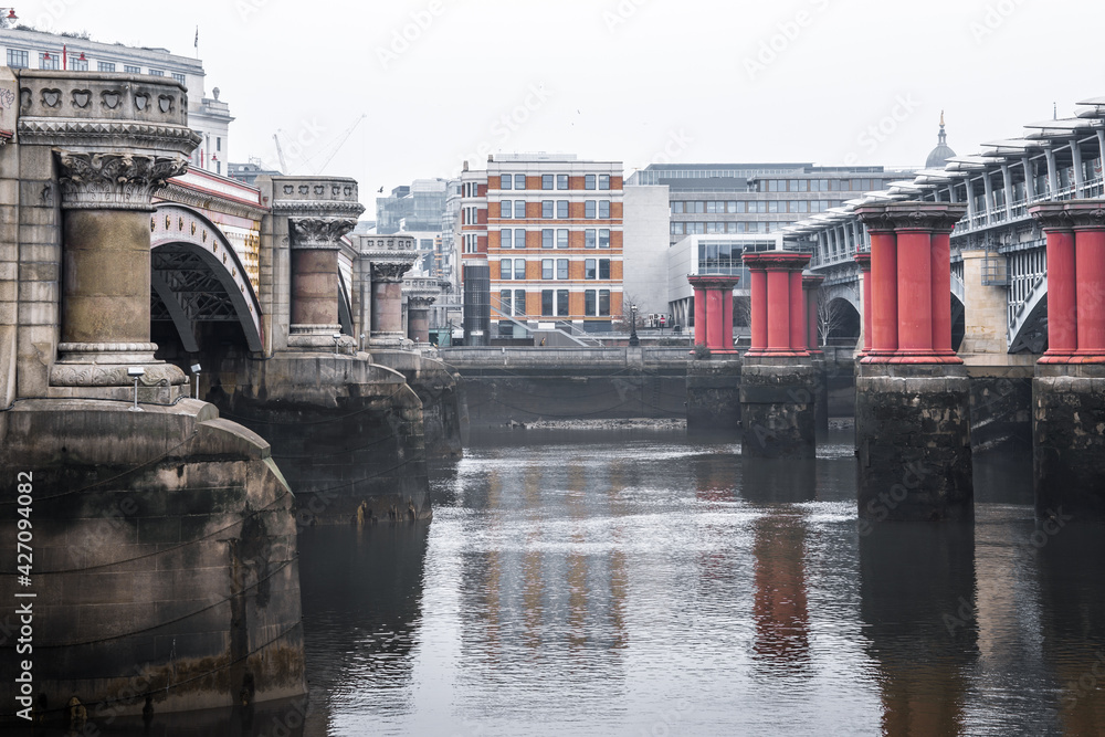 Naklejka premium River Thames and London bridges. London in rain. London during national lockdown UK, 2021