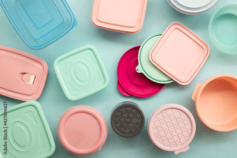 Fototapeta premium various containers for food storage on blue background
