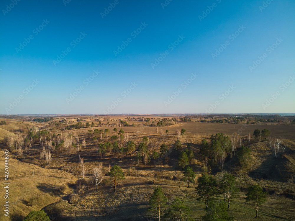 Obraz premium drone photo of flight above the fields and canyons