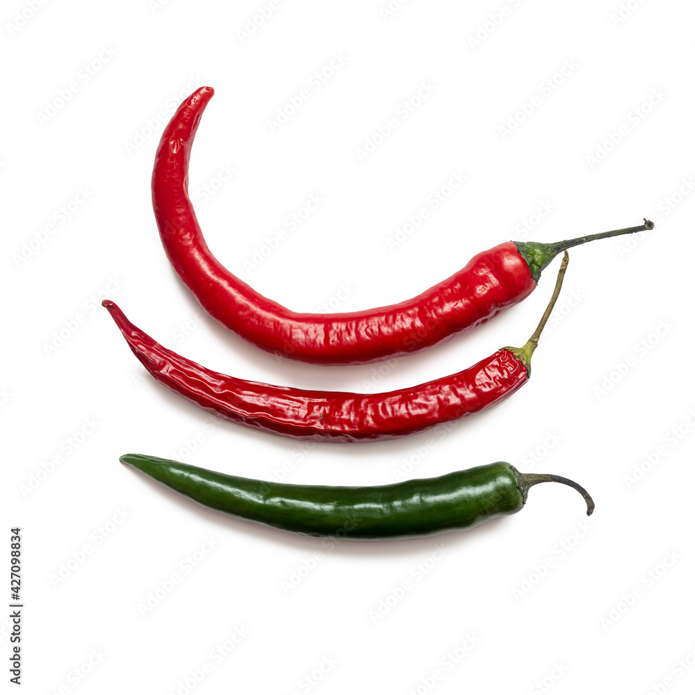 Three hot chili peppers on a white background