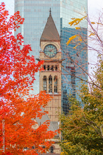 Canvas Print Historic clock tower with autumn red orange tree foliage