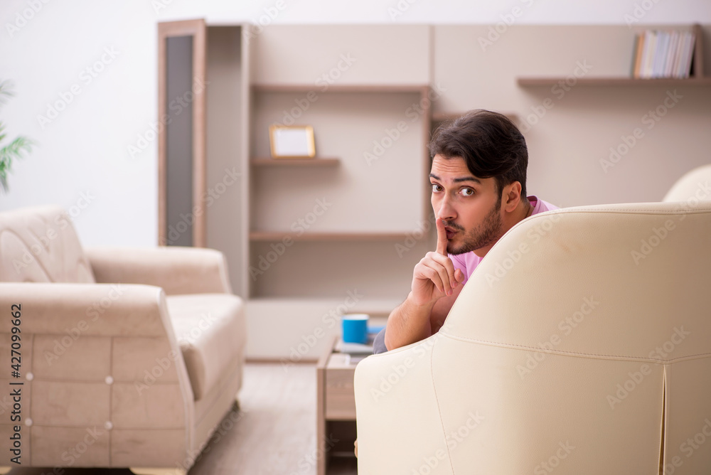 Young man siiting at home during pandemic Young man siiting at home during pandemic
