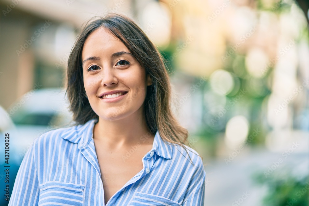 Young hispanic woman smiling happy standing at the city. Young hispanic woman smiling happy standing at the city.