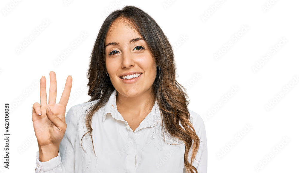 Young brunette woman wearing casual clothes showing and pointing up with fingers number three while smiling confident and happy. Young brunette woman wearing casual clothes showing and pointing up with fingers number three while smiling confident and happy.