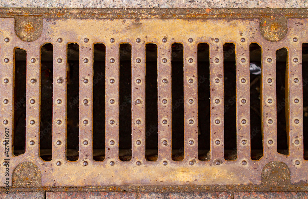Storm drain grate rusty background image 