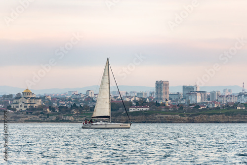 Sevastopol. Crimea. Autumn 2020. The yacht enters the bay of Sevastopol. The yacht goes under the mainsai.