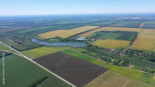 Panoramic view of a rural settlement in the fields, motorway from the rightPanoramic view of a rural settlement in the fields, motorway from the right