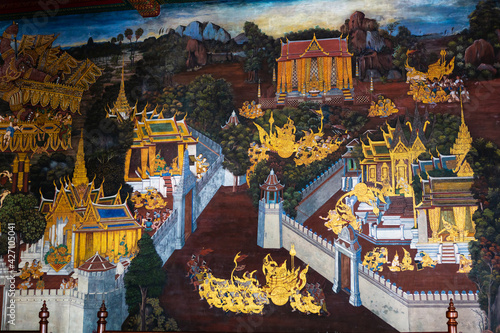 Ancient mural painting with scene from the Ramakien at Wat Phra Kaew or Emerald Buddha Temple in Bangkok, Thailand photo