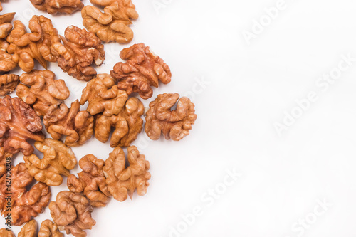 Peeled walnut halves on a white background isolated for design, copy space and mock up