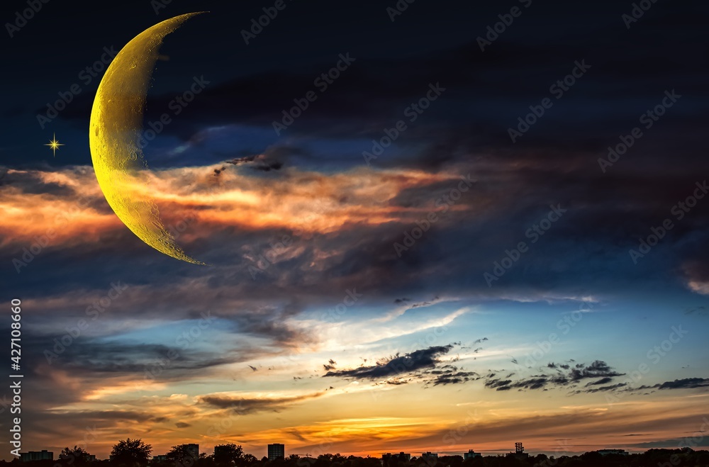 silhouette of the city against the backdrop of the sky and crescent silhouette of the city against the backdrop of the sky and crescent