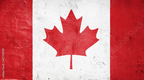 Canada flag on white concrete wall