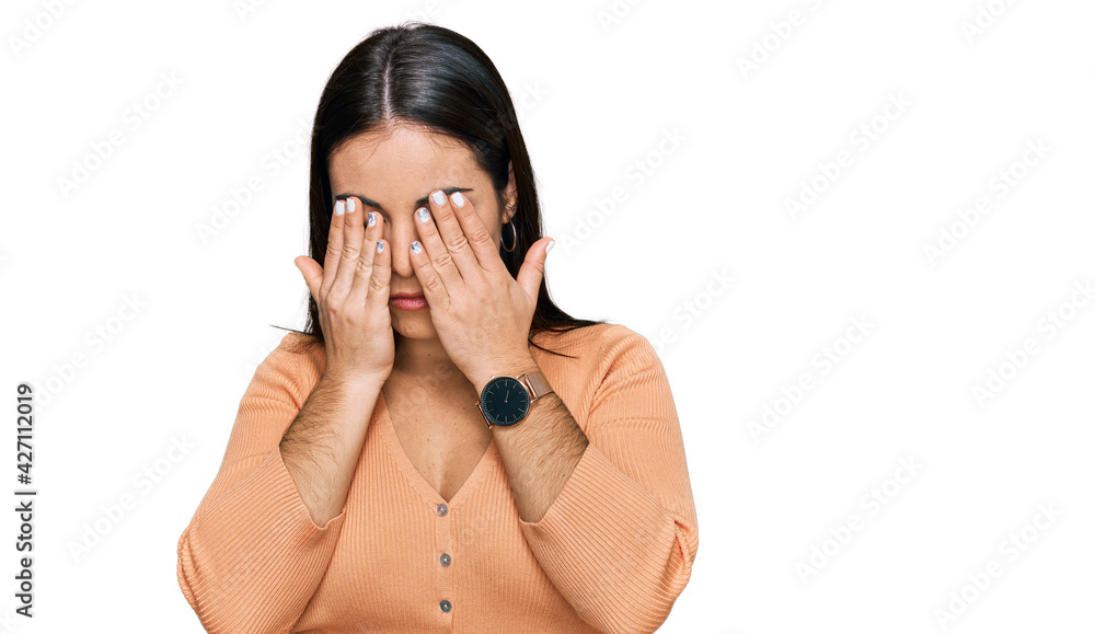 Young hispanic woman wearing casual clothes rubbing eyes for fatigue and headache, sleepy and tired expression. vision problem Young hispanic woman wearing casual clothes rubbing eyes for fatigue and headache, sleepy and tired expression. vision problem