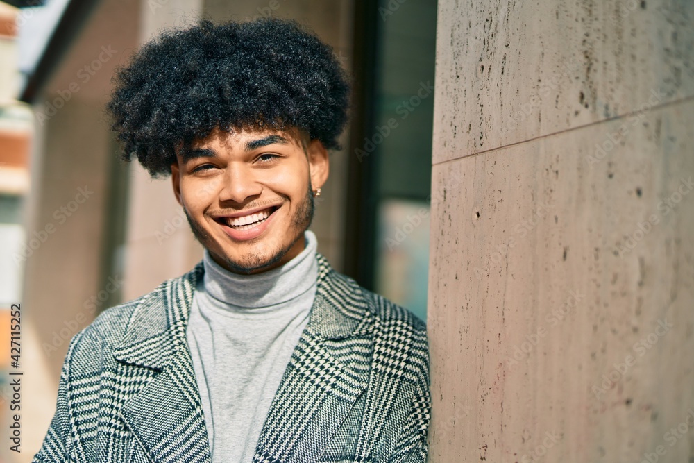 Young african american businessman smiling happy standing at the city. Young african american businessman smiling happy standing at the city.