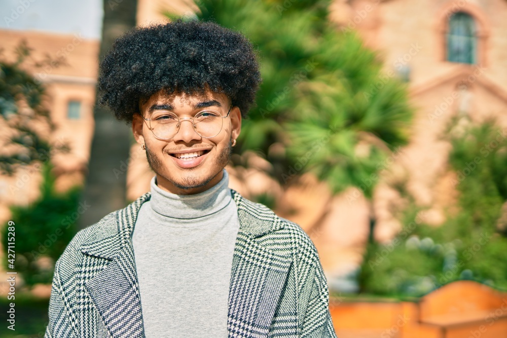 Young african american businessman smiling happy standing at the park. Young african american businessman smiling happy standing at the park.