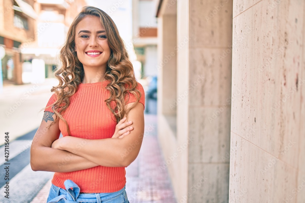 Young blonde girl smiling happy walking at the city. Young blonde girl smiling happy walking at the city.