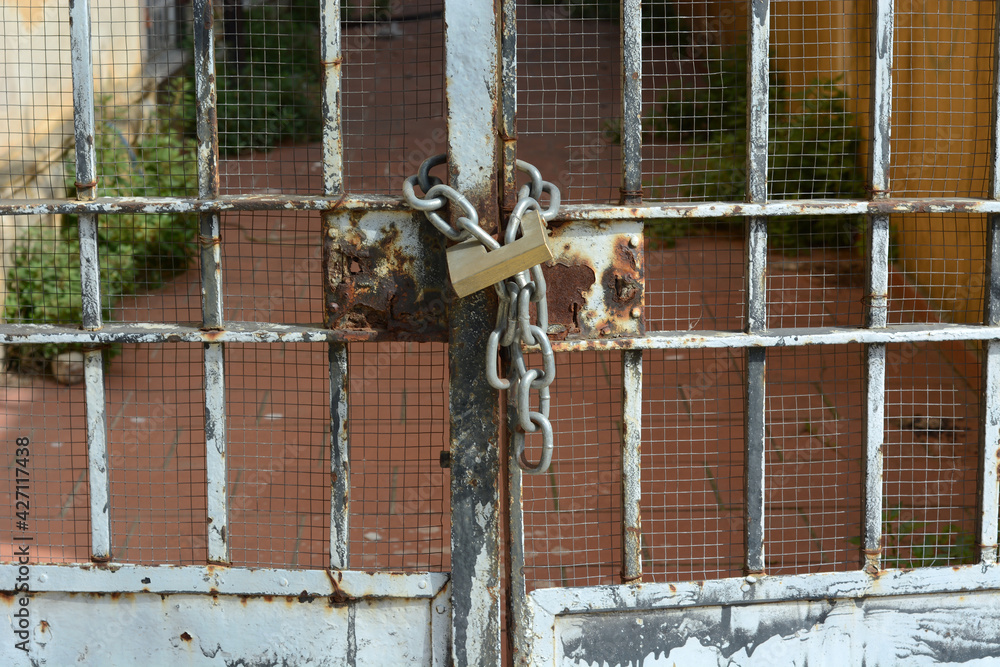 metal gate closed with chain and bolt metal gate closed with chain and bolt